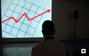 Man looking at a business chart