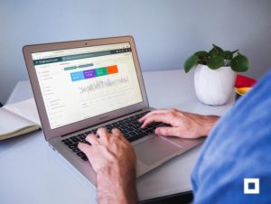 Person reviewing SEO results on laptop