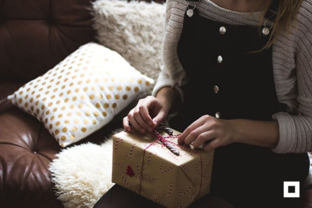 Woman wrapping gift