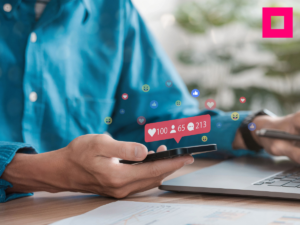 Social media and digital online concepts young man using smartphone with social media Holiday living and social media social distancing concept Work from home | Impressions Agency