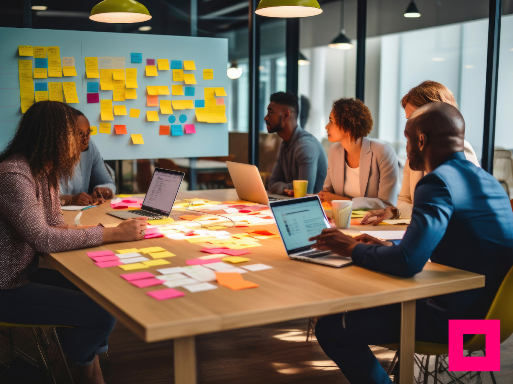 Employees brainstorming ideas to develop an effective content strategy, focusing on audience-centric content and impactful call-to-actions for better conversions.