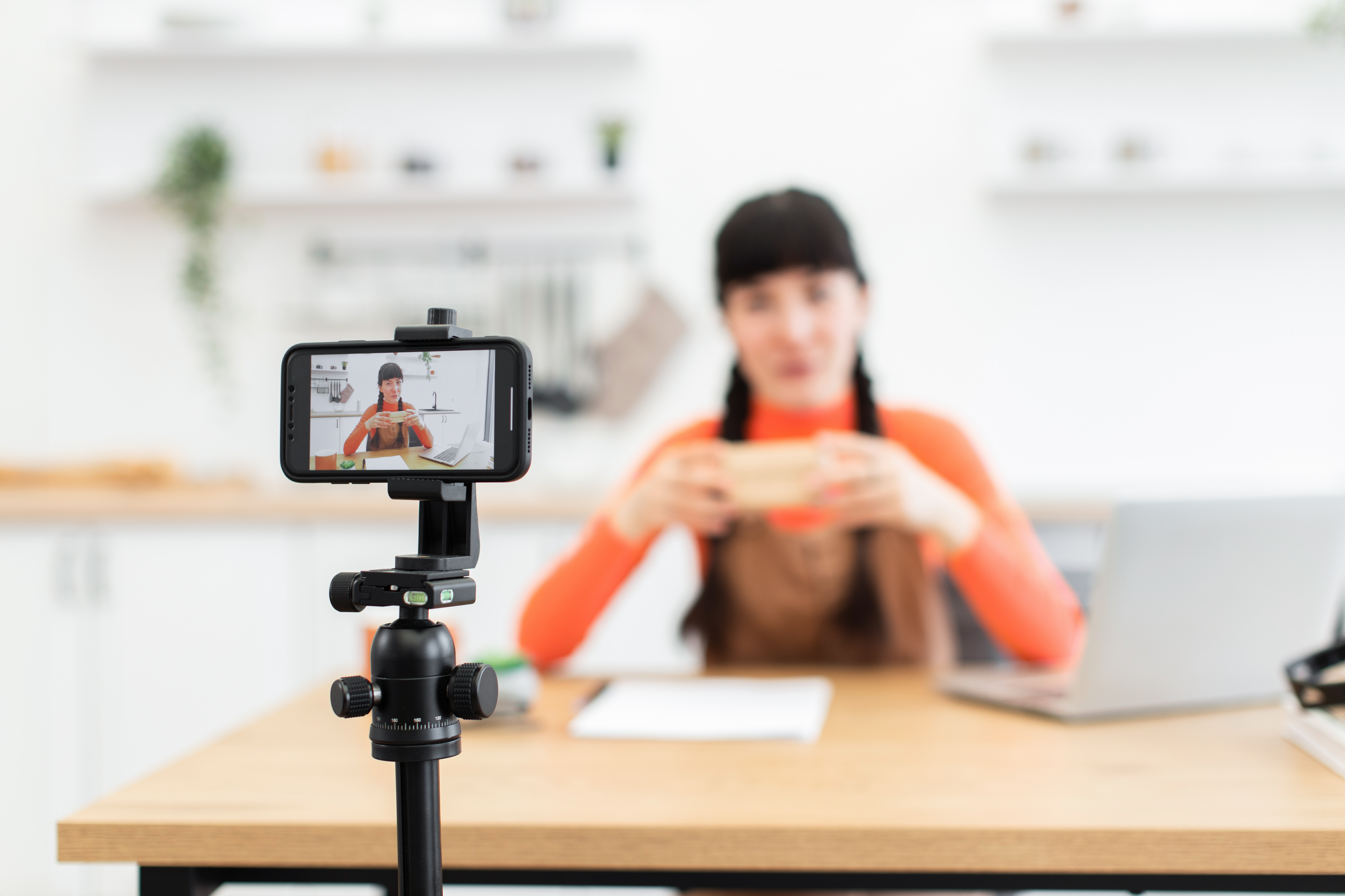 Caucasian woman filming unboxing video for her online lifestyle blog | Impressions Agency
